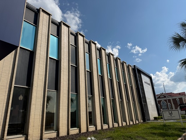 Exterior facade of Worknest Business Center at 201 Ohio Avenue South in downtown Live Oak, Florida, with the Worknest sign on the building